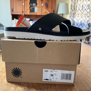 Women’s Black Ugg sandals, new in the box, size 10.